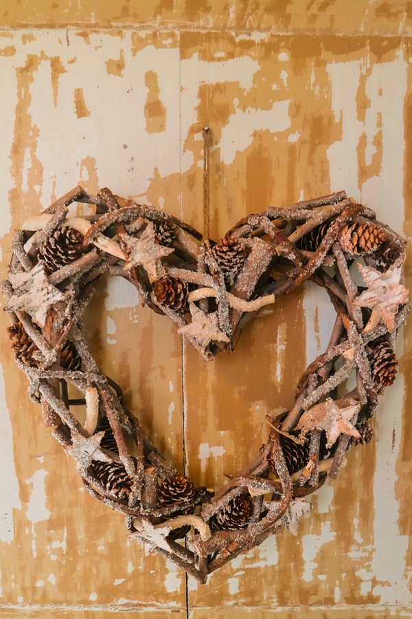 Are you looking for cute Valentine's Day decorations? Why not make some adorable Valentine's wood decor? This heart wreath is easy to make and will look so cute in your home. 