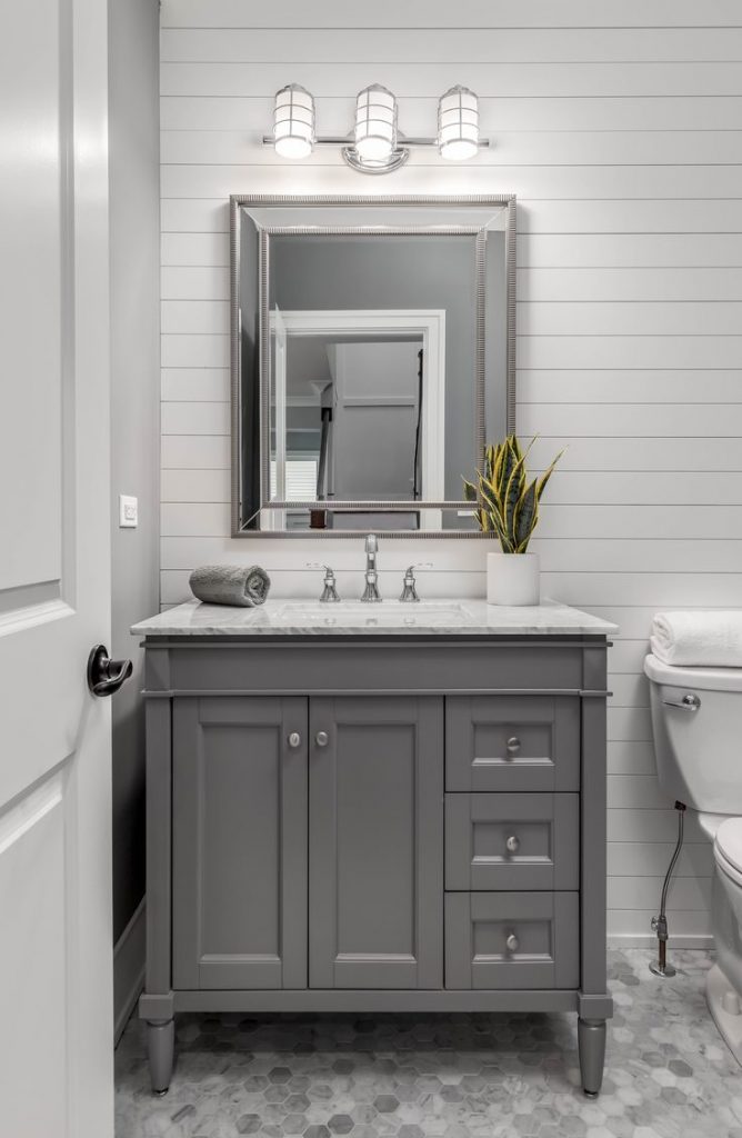 Shiplap isn't just a plain Jane way to cover a wall. Shiplap is more versatile than you may think. Learn how to use shiplap in your bathroom! 