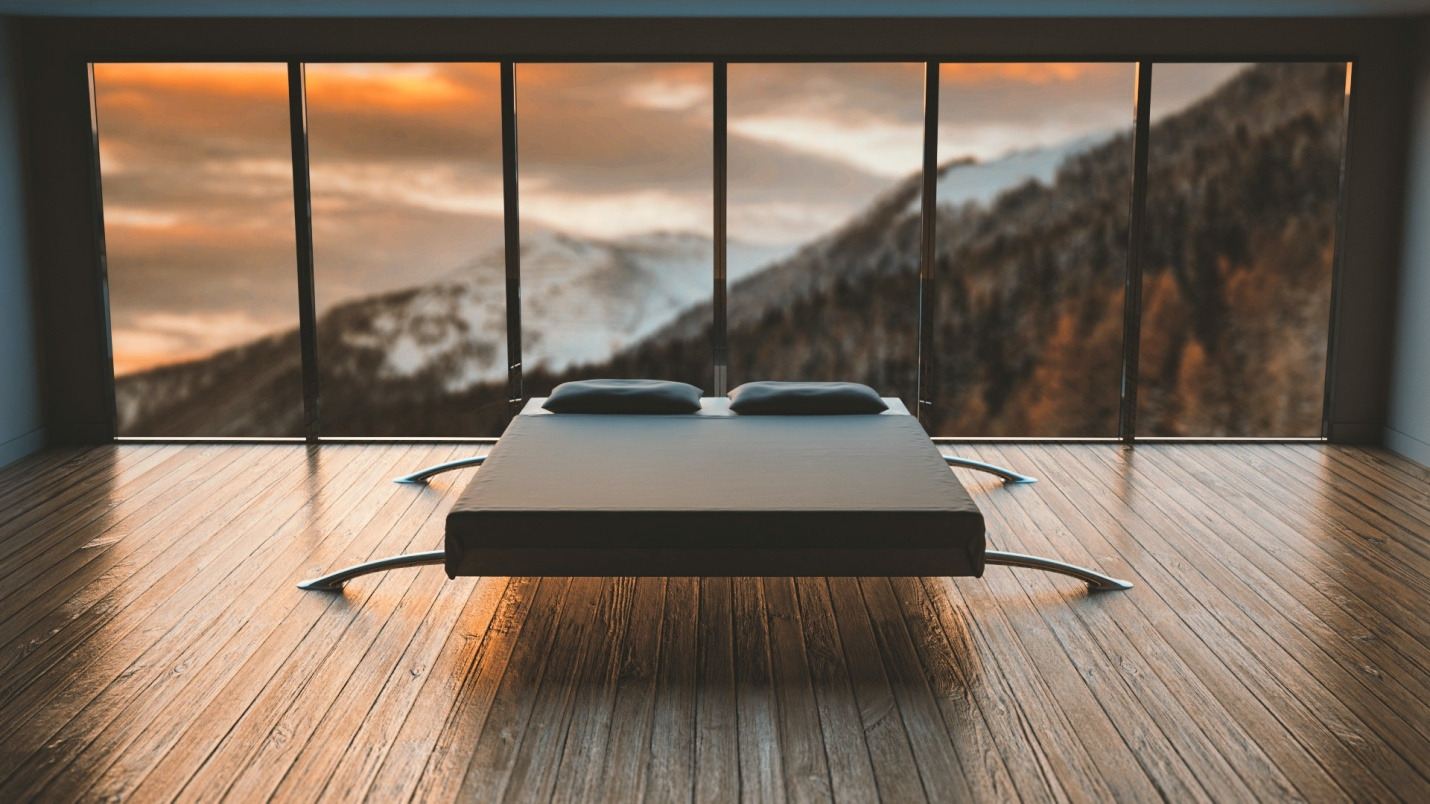 A mattress placed on a wooden floor